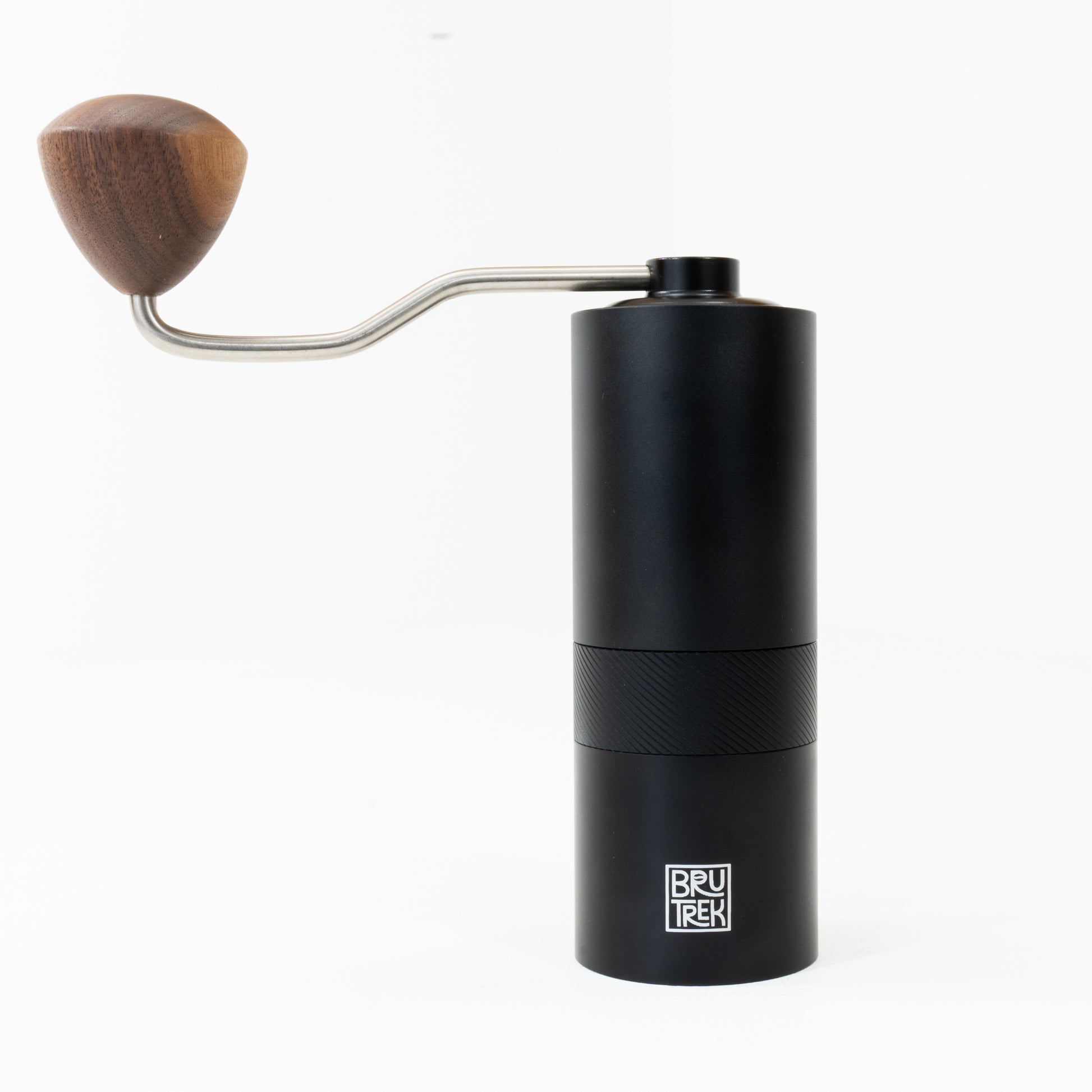 Black hand coffee grinder with wooden handle on a white background